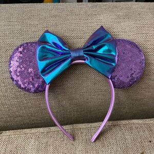 Purple sparkly Disney ears with blue bow